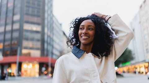 Confident woman with curly hair